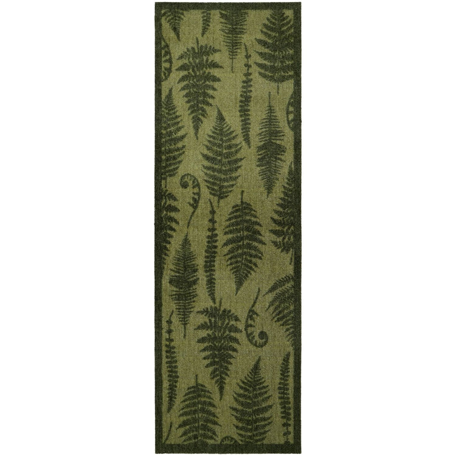 Green fern patterned rug on a white background