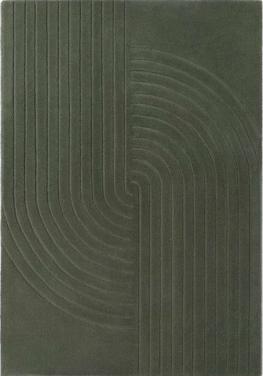 Dark green rug with wavy pattern on a plain background