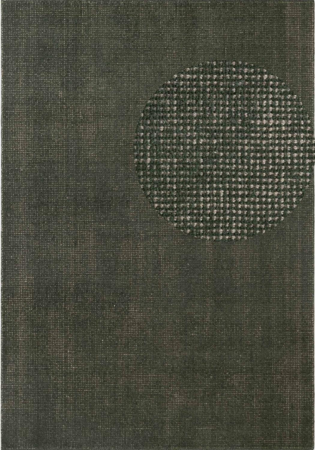 Textured green rug with a circular pattern in the center