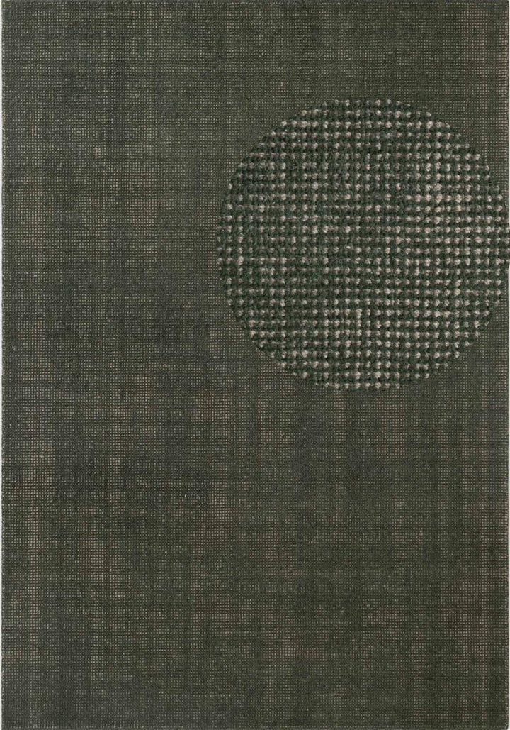 Textured green rug with a circular pattern in the center