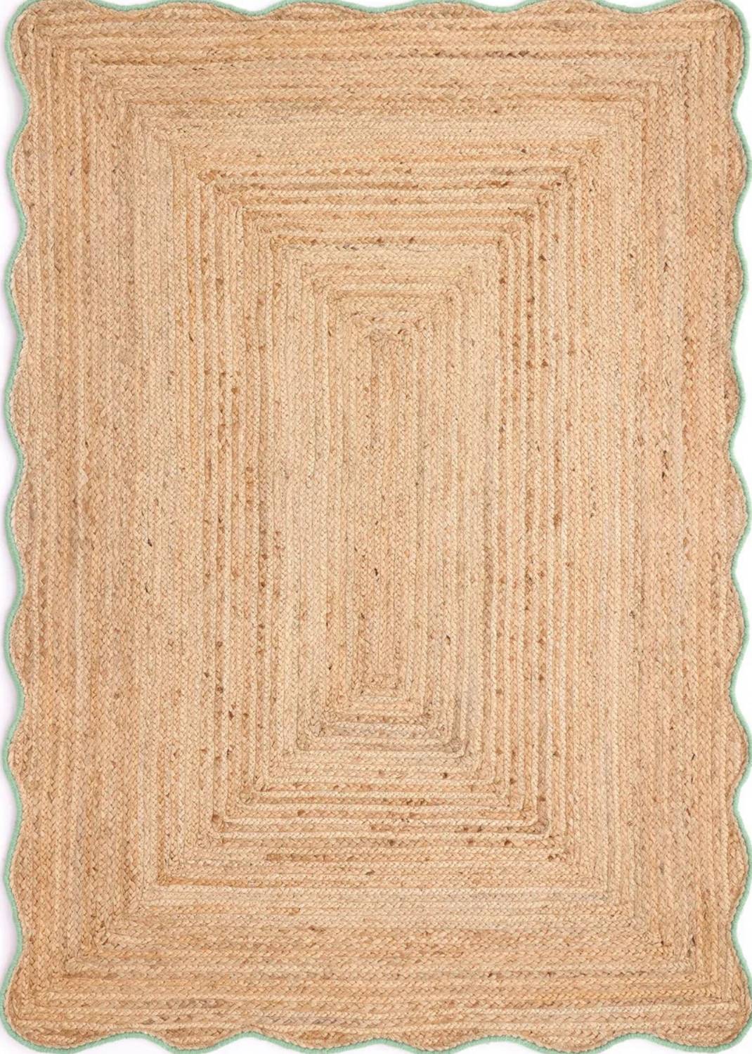 Beige braided rug on a white background
