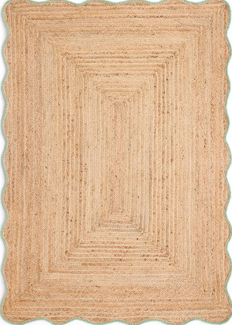 Beige braided rug on a white background