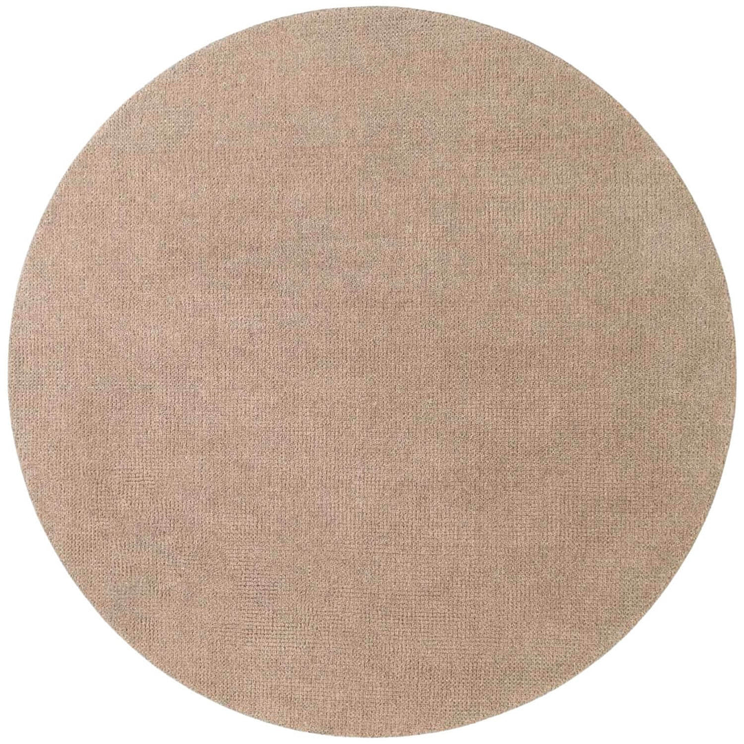 Round beige rug on a white background