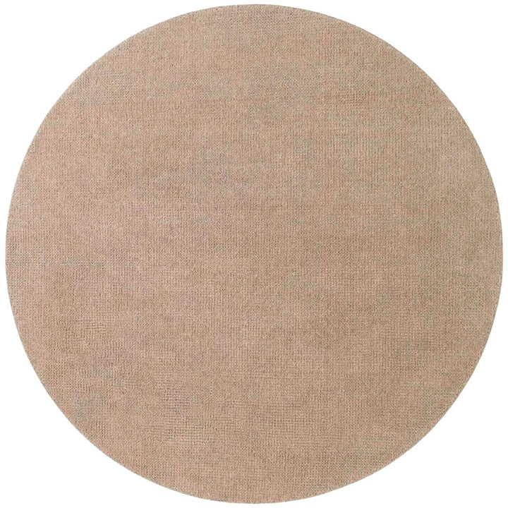 Round beige rug on a white background