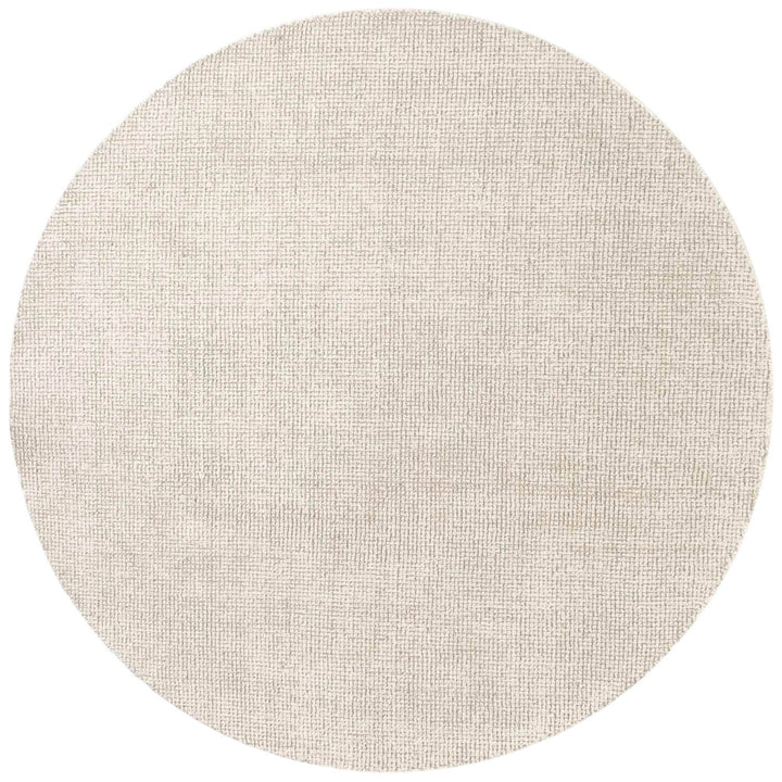 Round beige rug on a white background