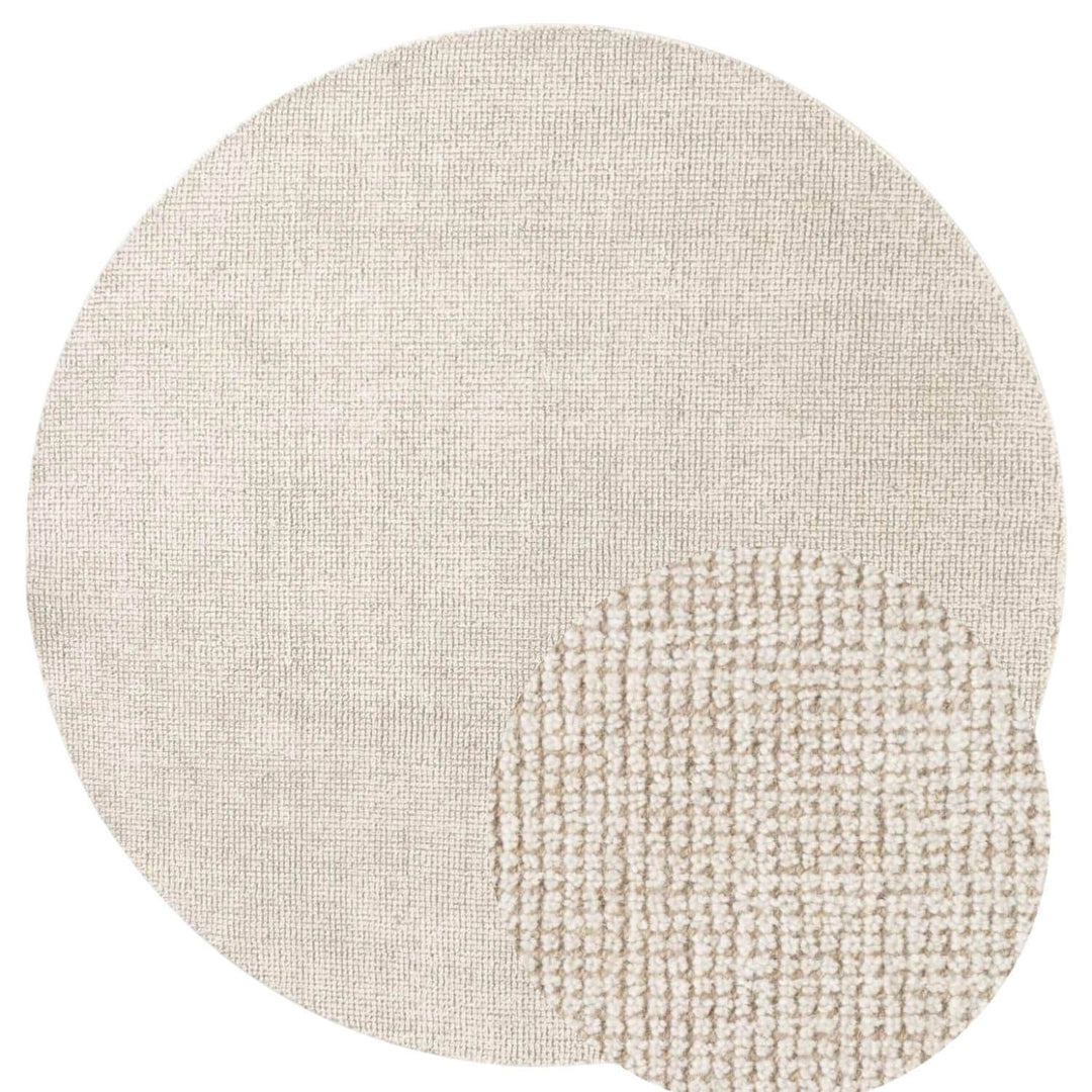 Textured beige rug with a circular design on a white background
