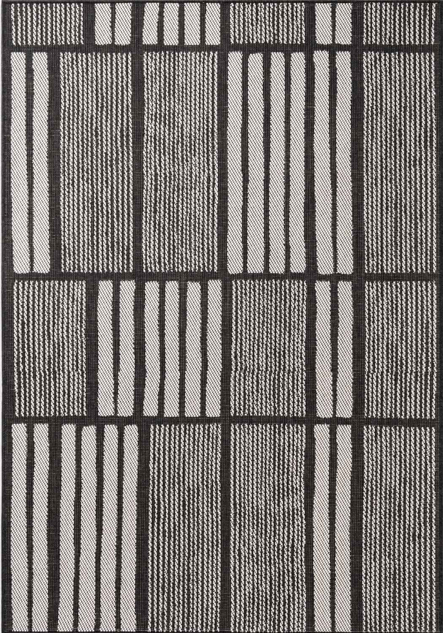 Black and white striped patterned rug