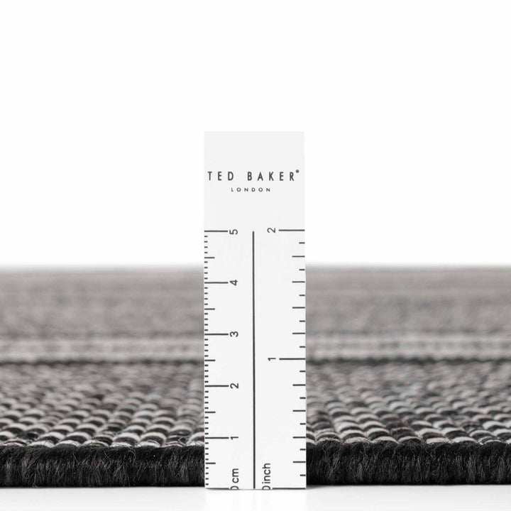 Ted Baker London rug with a ruler for scale on a white background