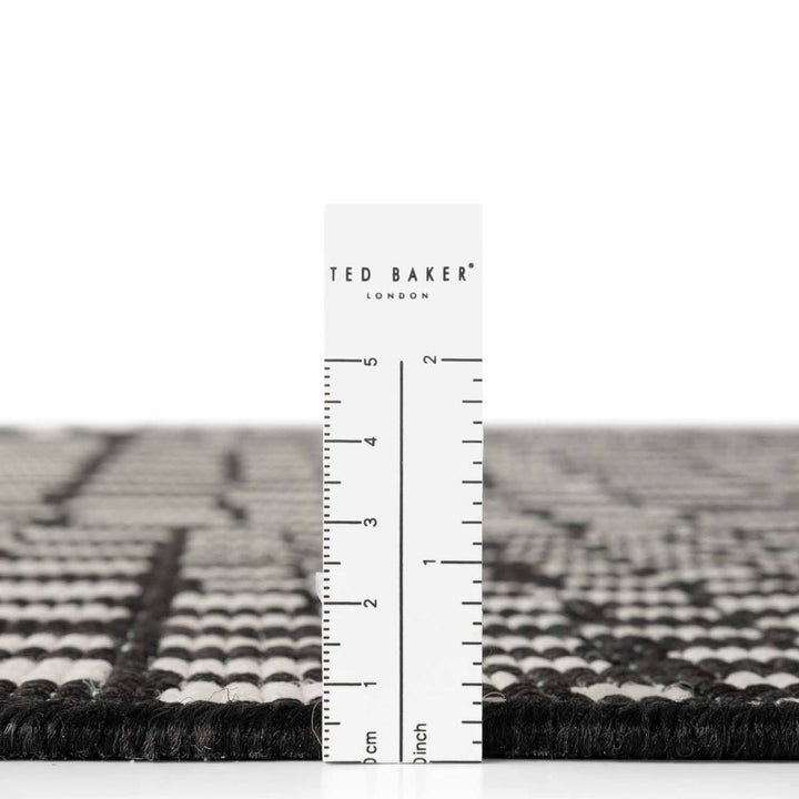 Ted Baker London rug with a ruler for scale on a white background
