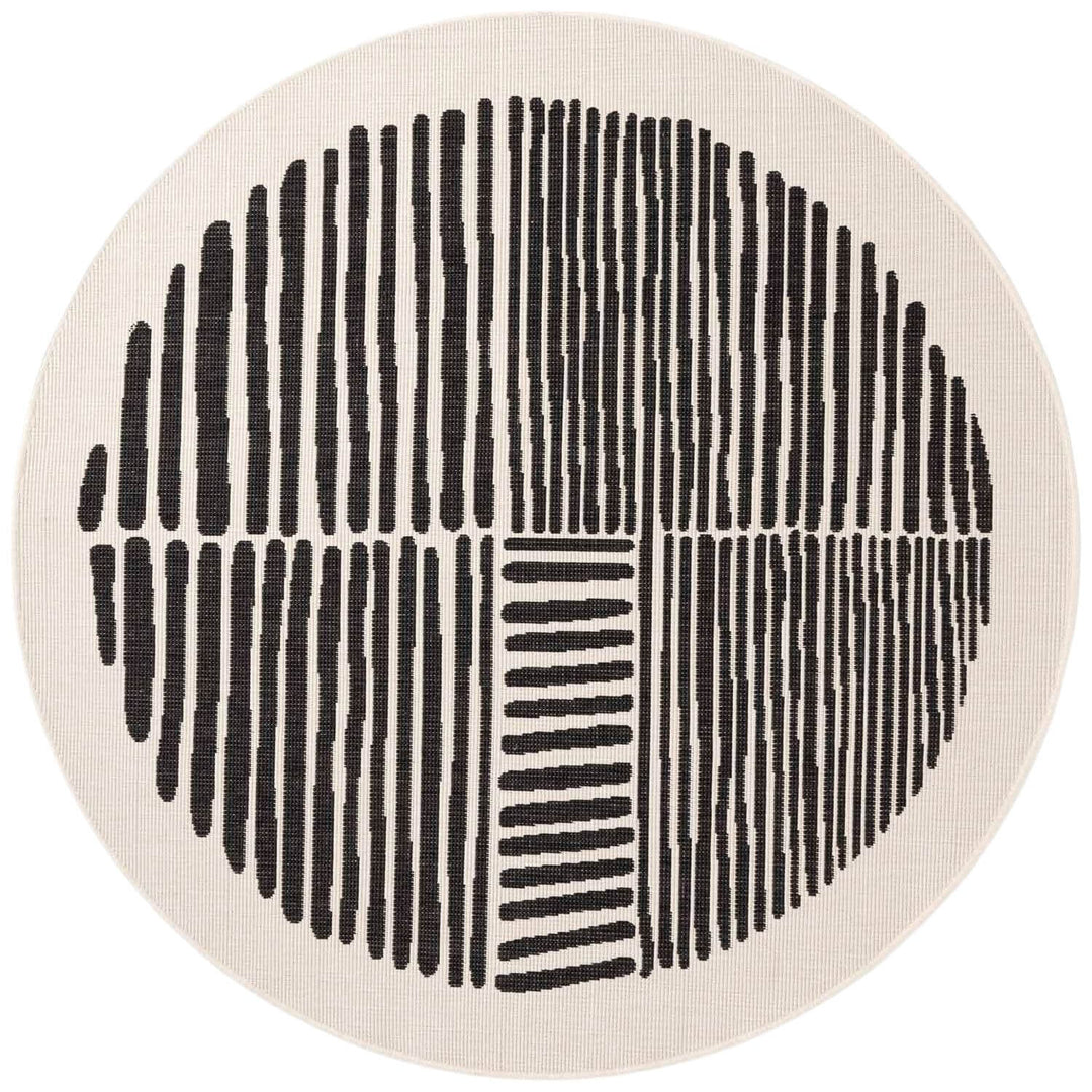 Round rug with black line pattern on a beige background