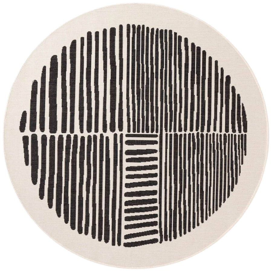 Round rug with black line pattern on a beige background
