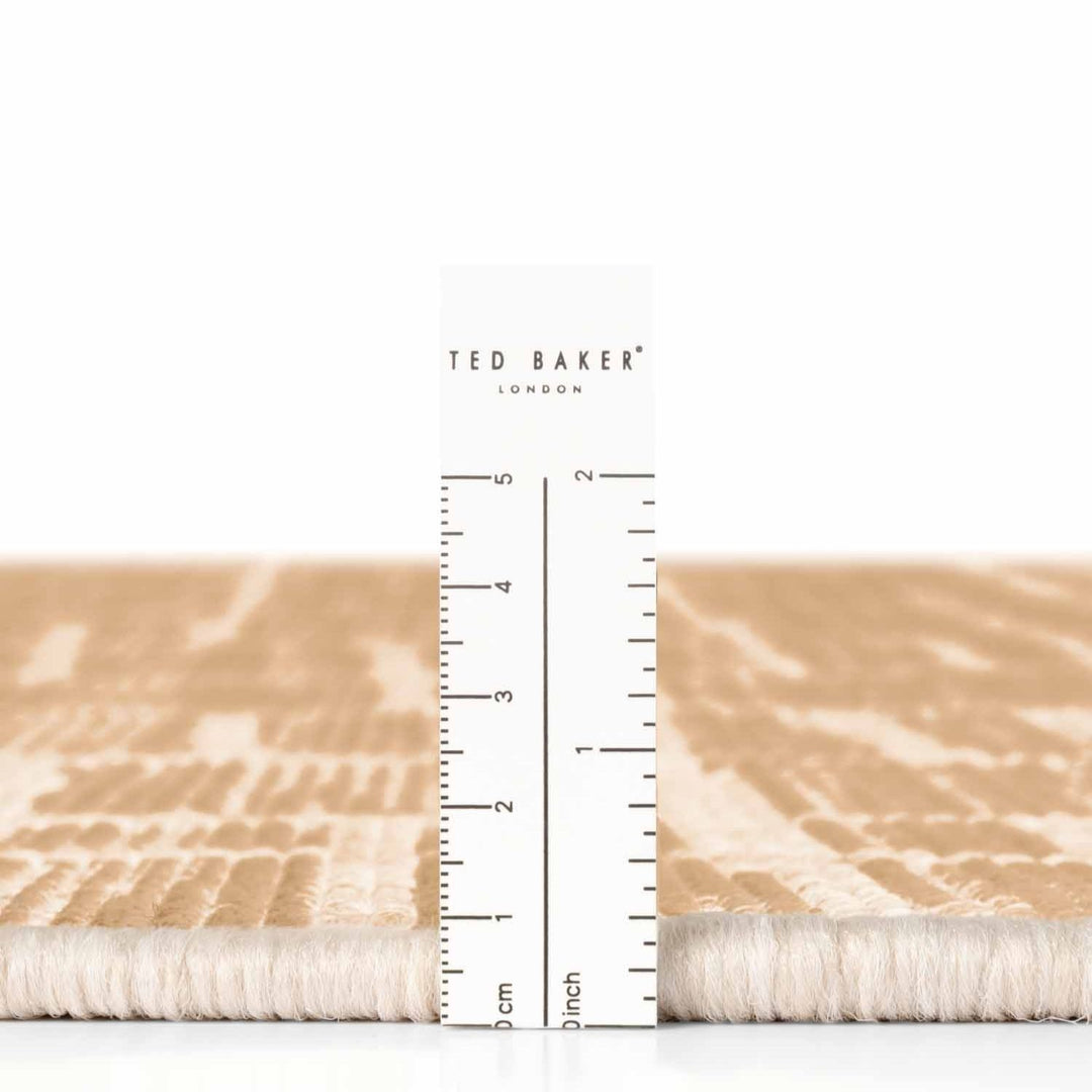 Ted Baker fabric swatch with a ruler for scale on a white background
