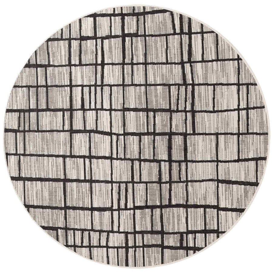 Round rug with black line pattern on a white background