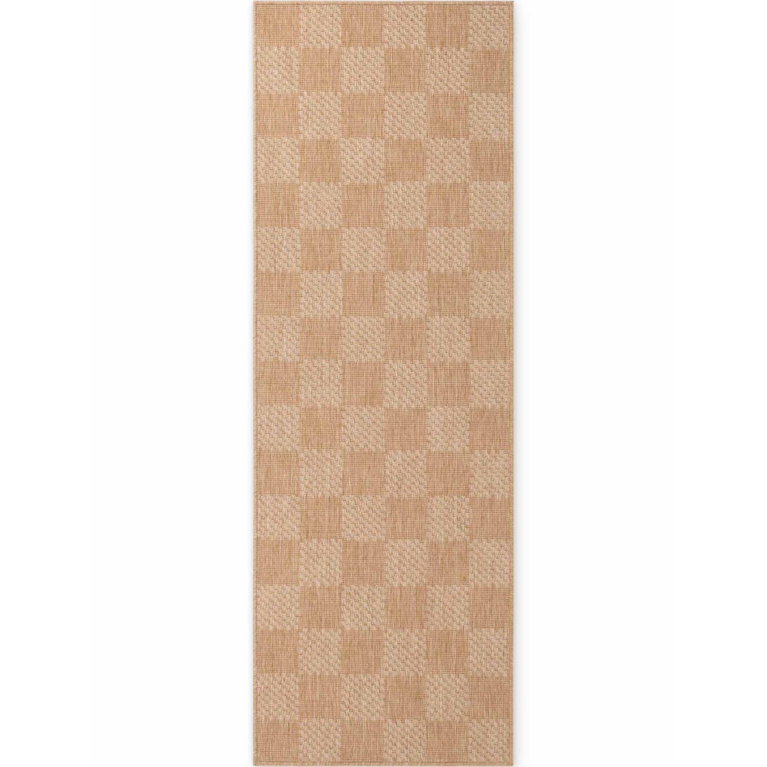 Beige checkered patterned rug on a white background