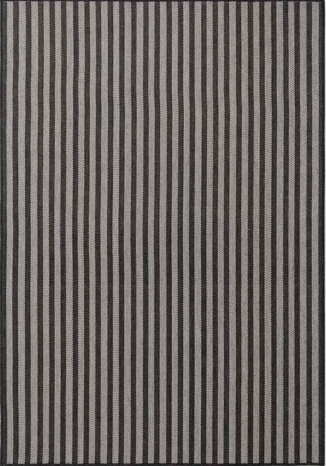 Striped rug with black and gray vertical lines on a plain background