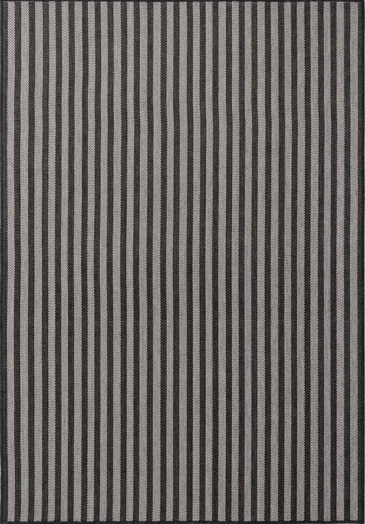 Striped rug with black and gray vertical lines on a plain background