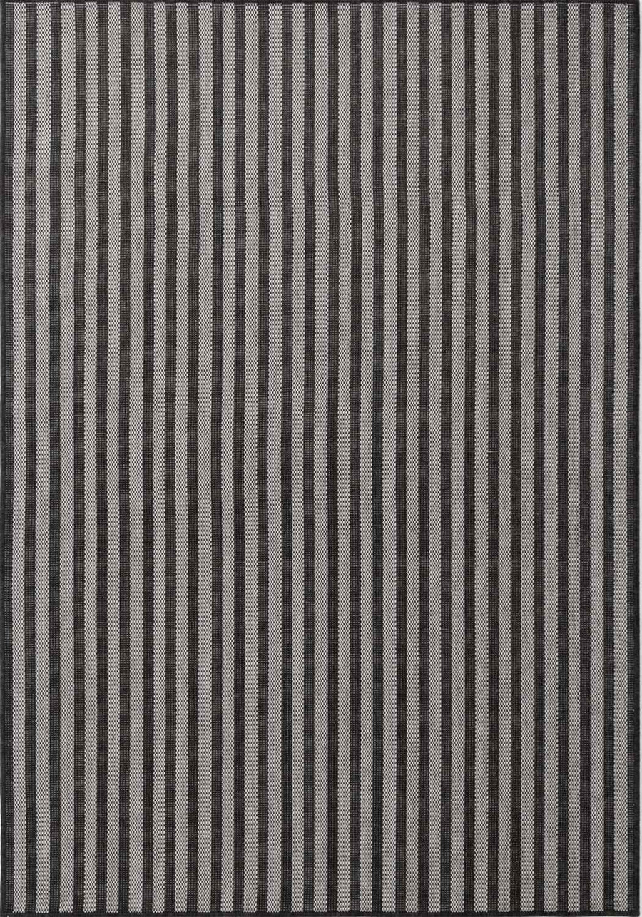 Striped rug with black and gray vertical lines on a plain background