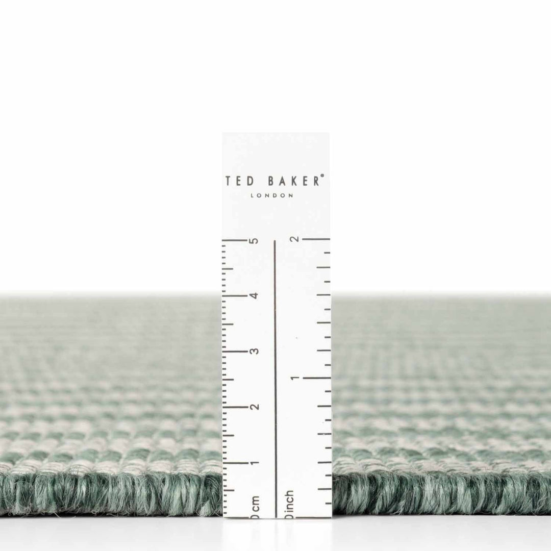 Ted Baker fabric swatch with a ruler for scale on a white background