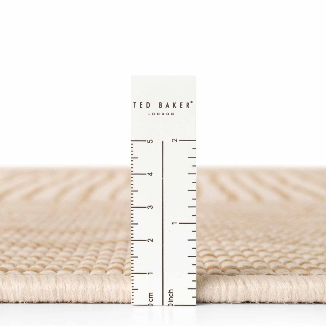 Ted Baker fabric swatch with a ruler for scale on a white background