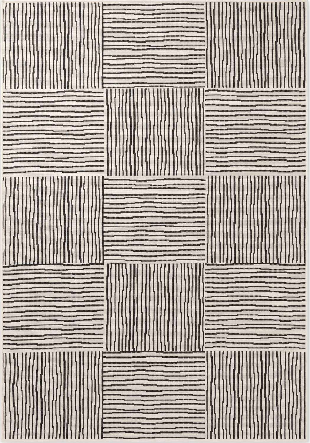Patterned rug with black lines on a beige background