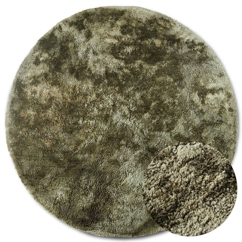 Round green rug with a textured surface on a white background