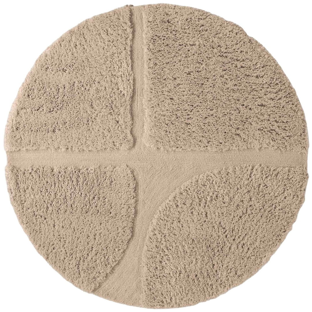 Round beige rug with a textured surface on a white background