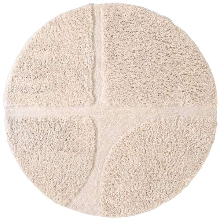 Round beige rug with a textured surface on a white background