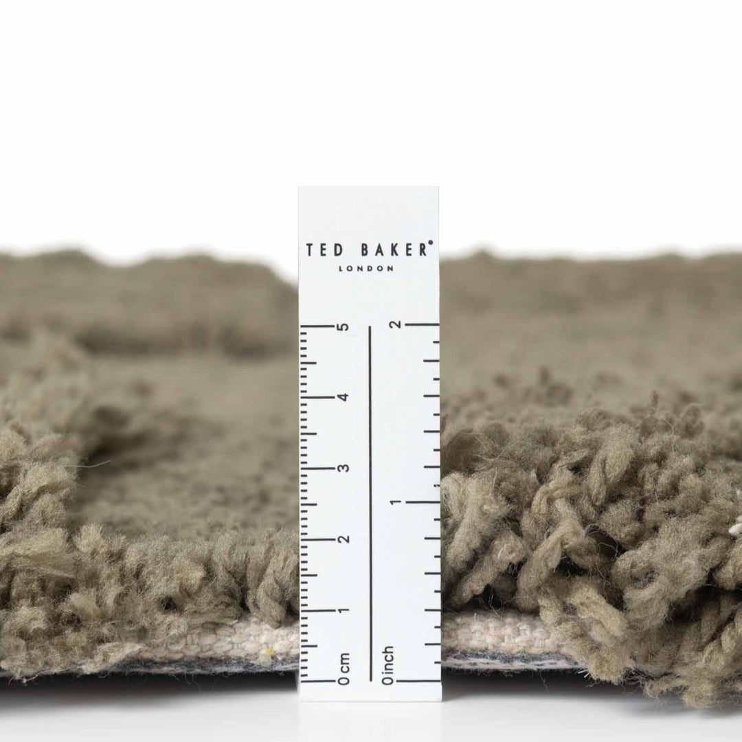 Textured fabric with a ruler and 'Ted Baker London' label