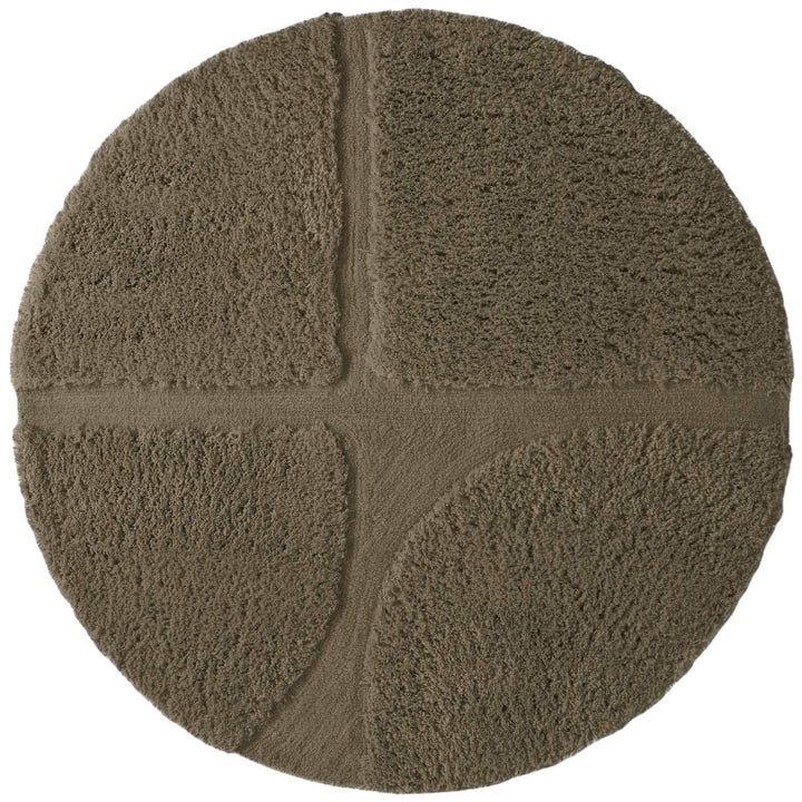 Round brown bath mat with textured surface on a white background