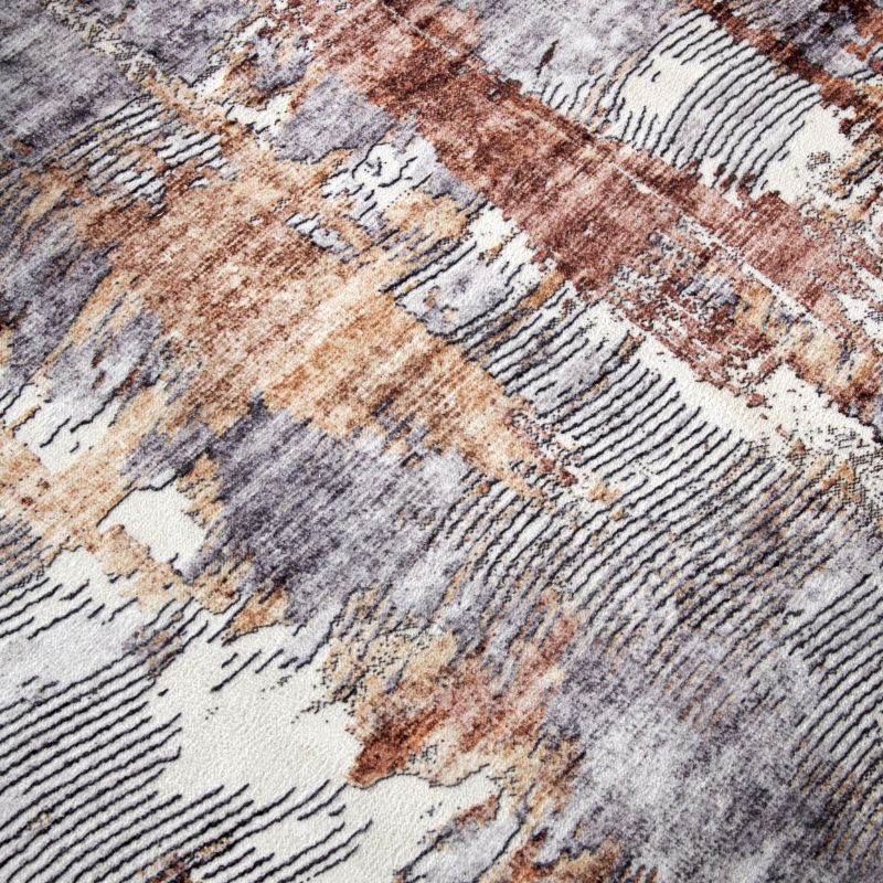 Close-up of a textured rug with brown, gray, and beige colors.