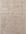 Beige area rug with a subtle pattern on a plain background