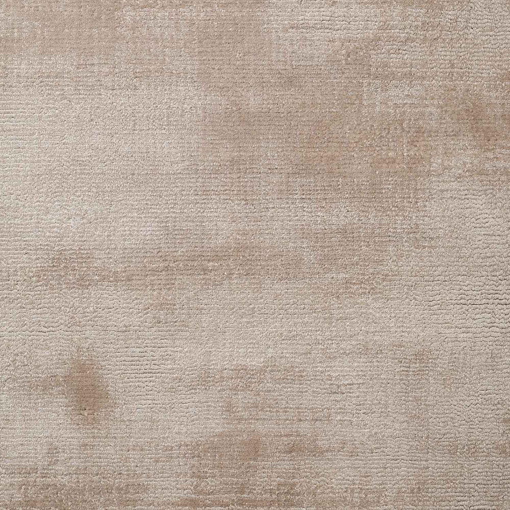 Textured beige carpet with a subtle pattern