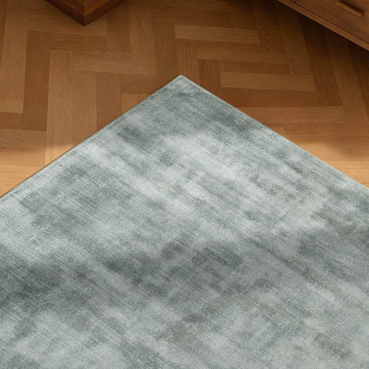 Gray rug on a wooden floor