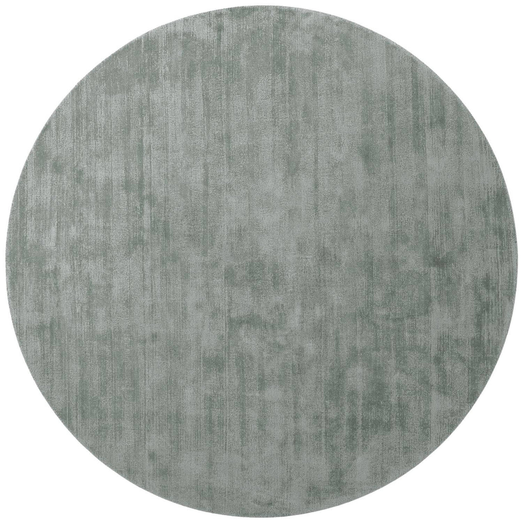 Round gray rug on a white background
