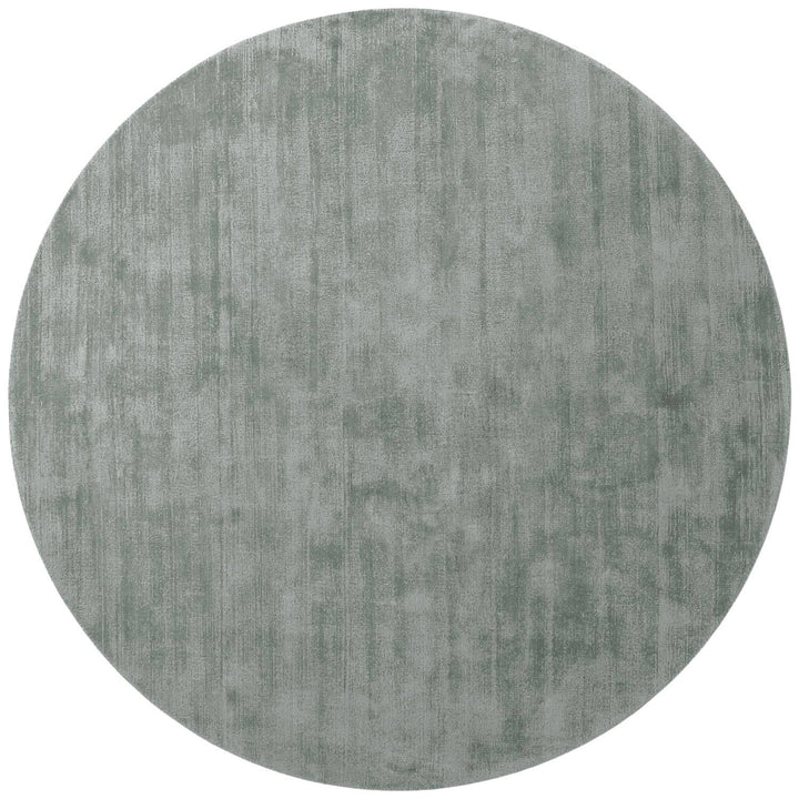 Round gray rug on a white background