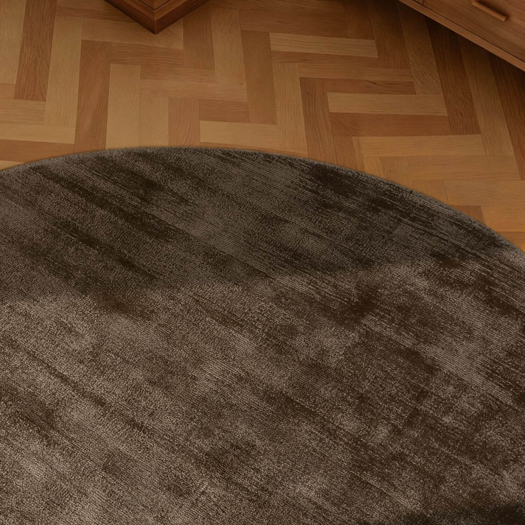 Brown rug on a wooden floor