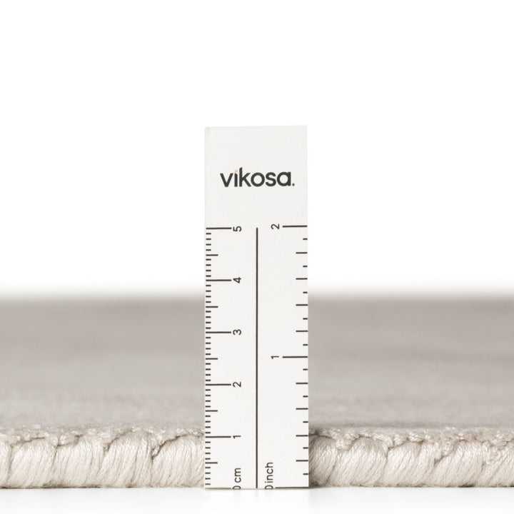 Vikosa yarn with a ruler for measurement on a white background