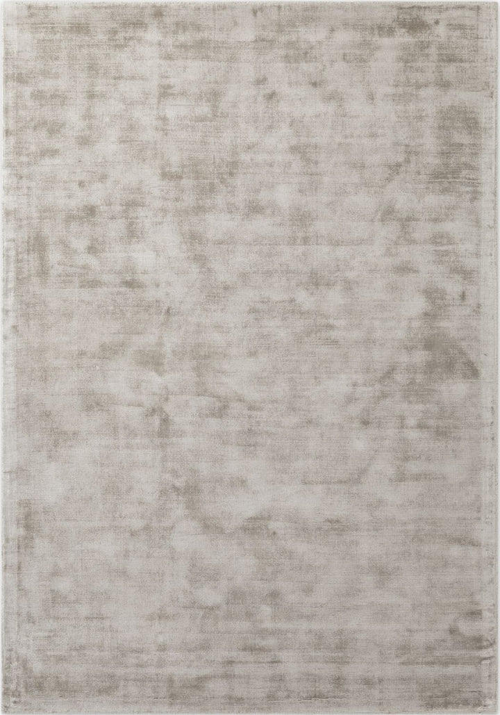Textured area rug with a neutral color palette on a plain background