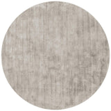 Round beige rug on a white background
