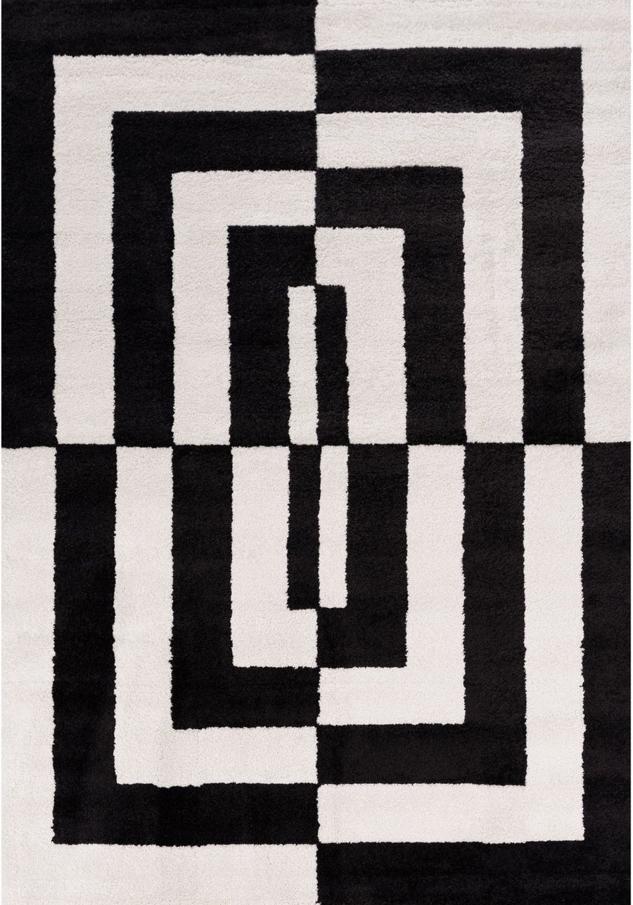 Black and white geometric patterned rug