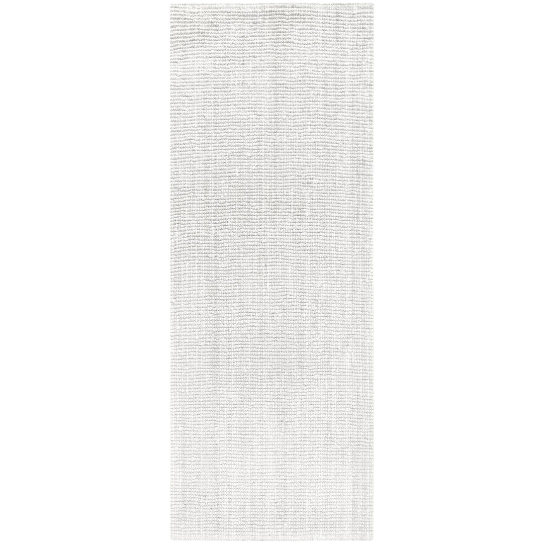 Rectangular area rug with a subtle pattern on a plain background