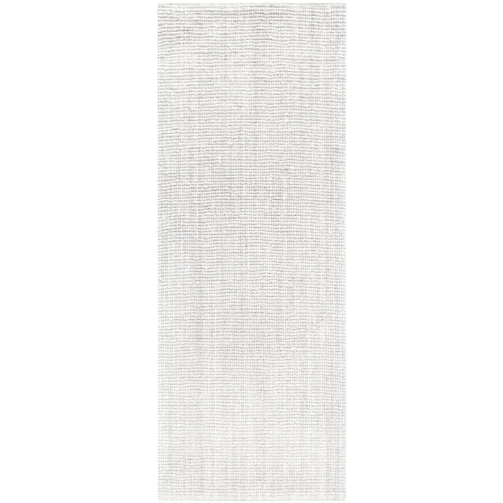 Rectangular area rug with a subtle pattern on a plain background