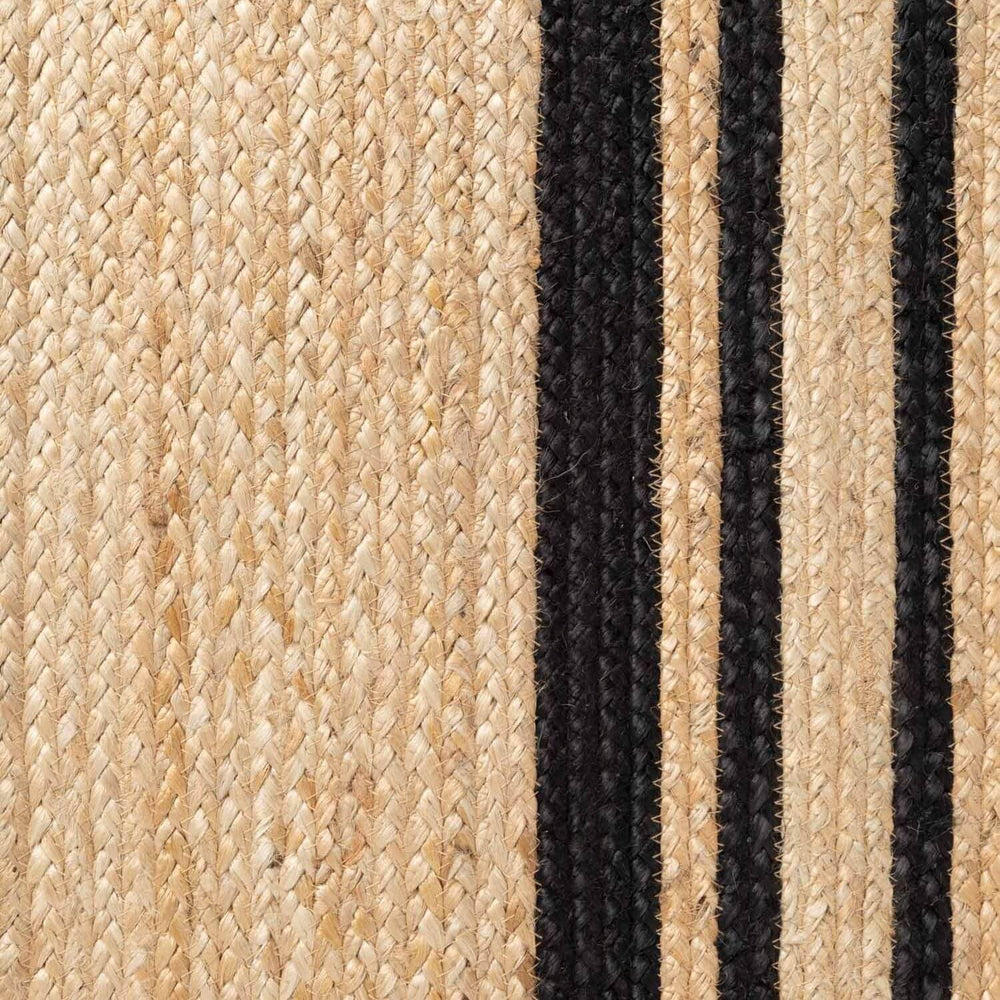Close-up of woven jute rug with black stripes
