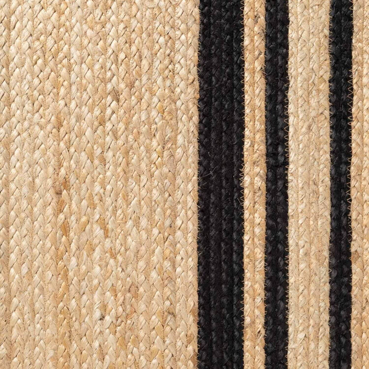 Close-up of woven jute rug with black stripes