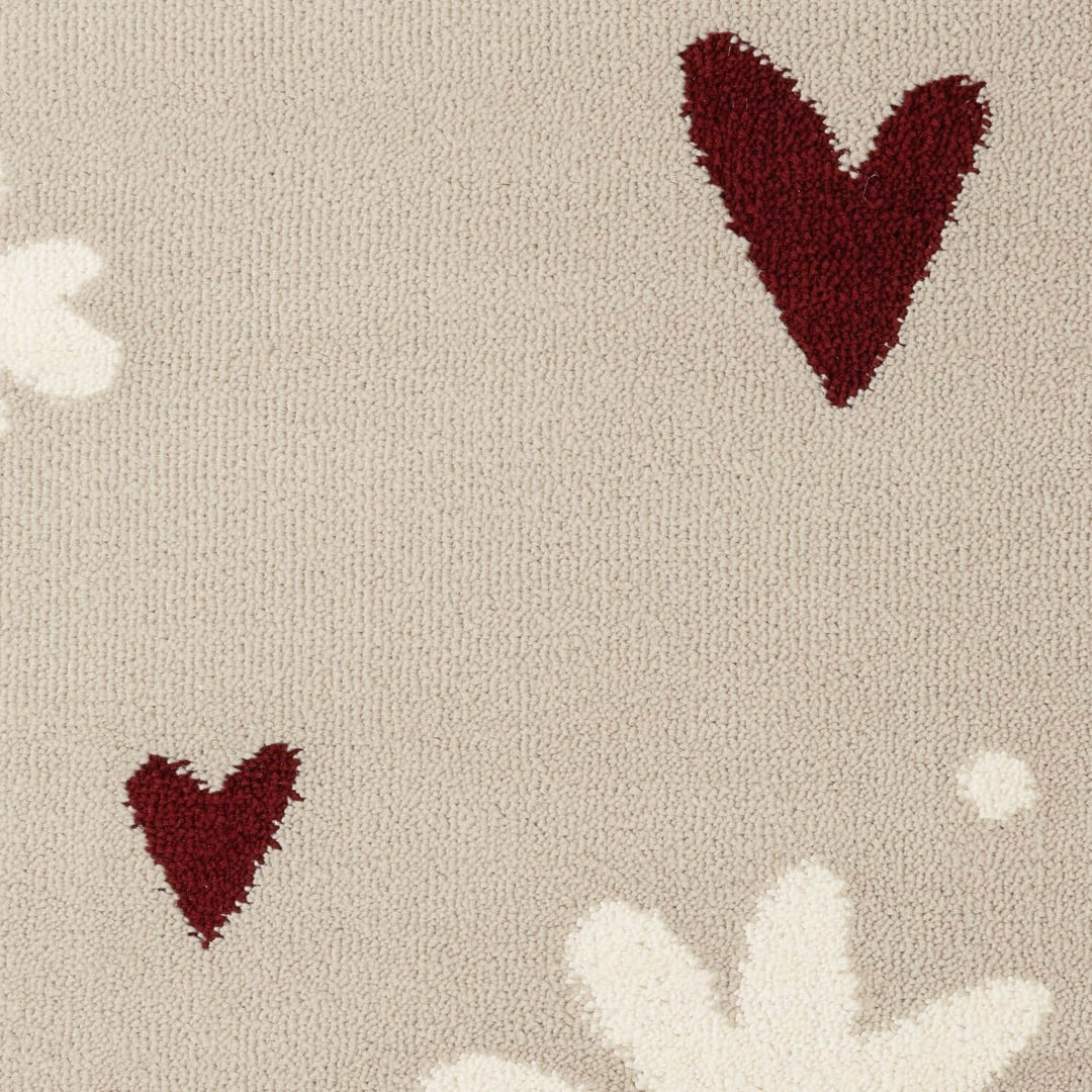 Pattern of red hearts and white flowers on a beige background