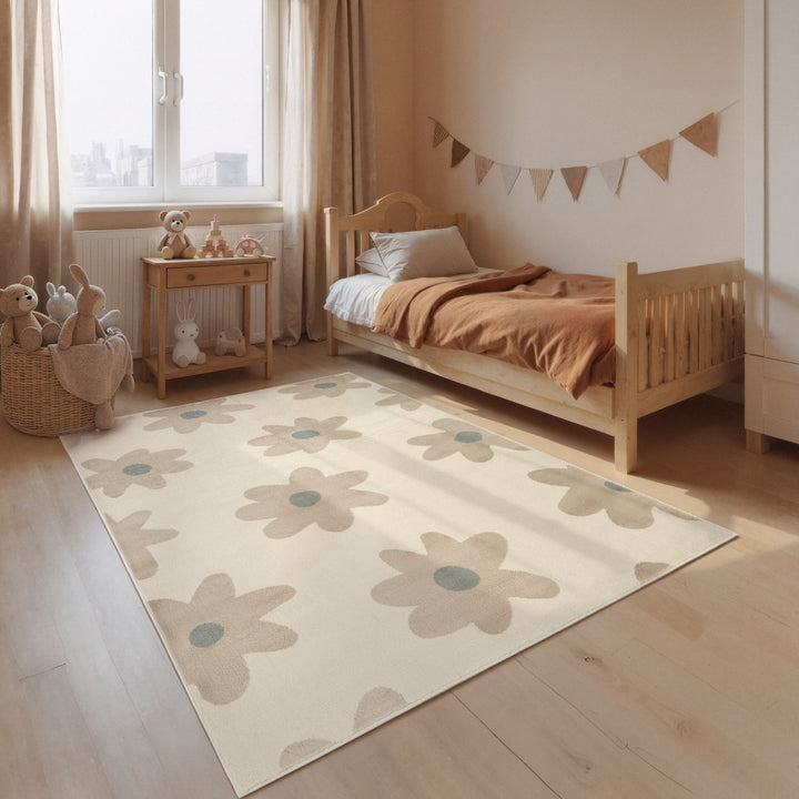 Children's bedroom with a floral rug, wooden bed, and toys.