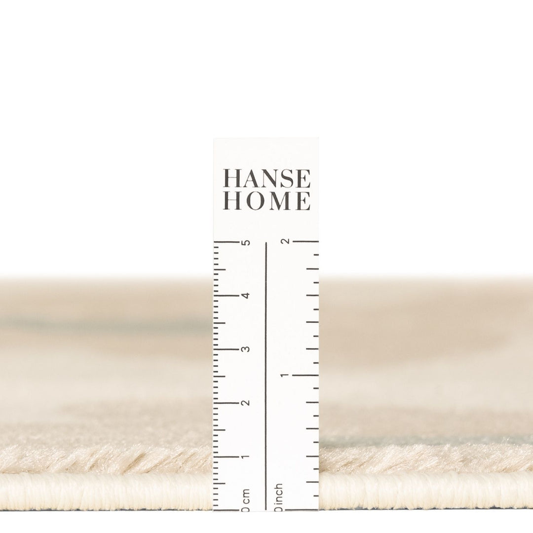 Beige fabric swatch with a ruler and 'Hanse Home' branding on a white background
