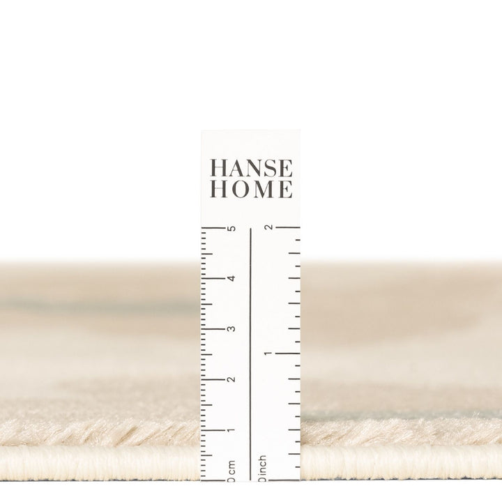 Beige fabric swatch with a ruler and 'Hanse Home' branding on a white background