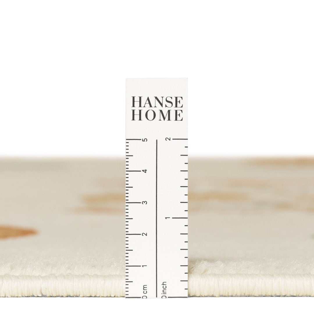Textured fabric swatch with a ruler for measurement, branded 'HANSE HOME'.