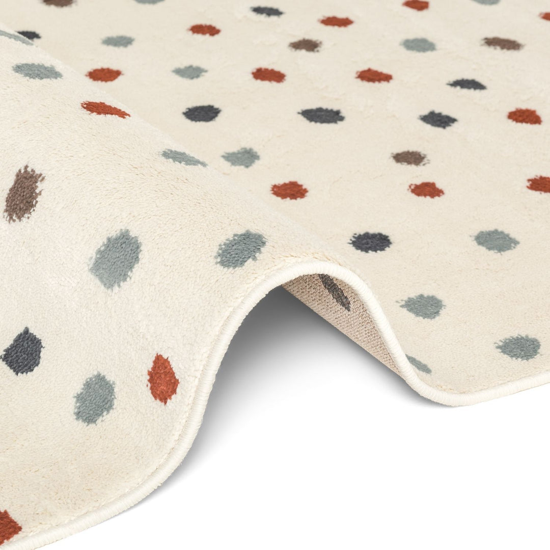 Beige rug with multicolored abstract pattern on a white background